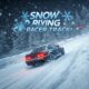 A dark grey car drifts on a snow-covered race track surrounded by snow-covered trees. Snowflakes fall around the car. The game title 