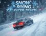 A dark grey car drifts on a snow-covered race track surrounded by snow-covered trees. Snowflakes fall around the car. The game title 