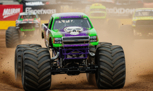 Offroad monster truck racing through rugged terrain in Trucks Race game