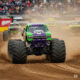 Offroad monster truck racing through rugged terrain in Trucks Race game